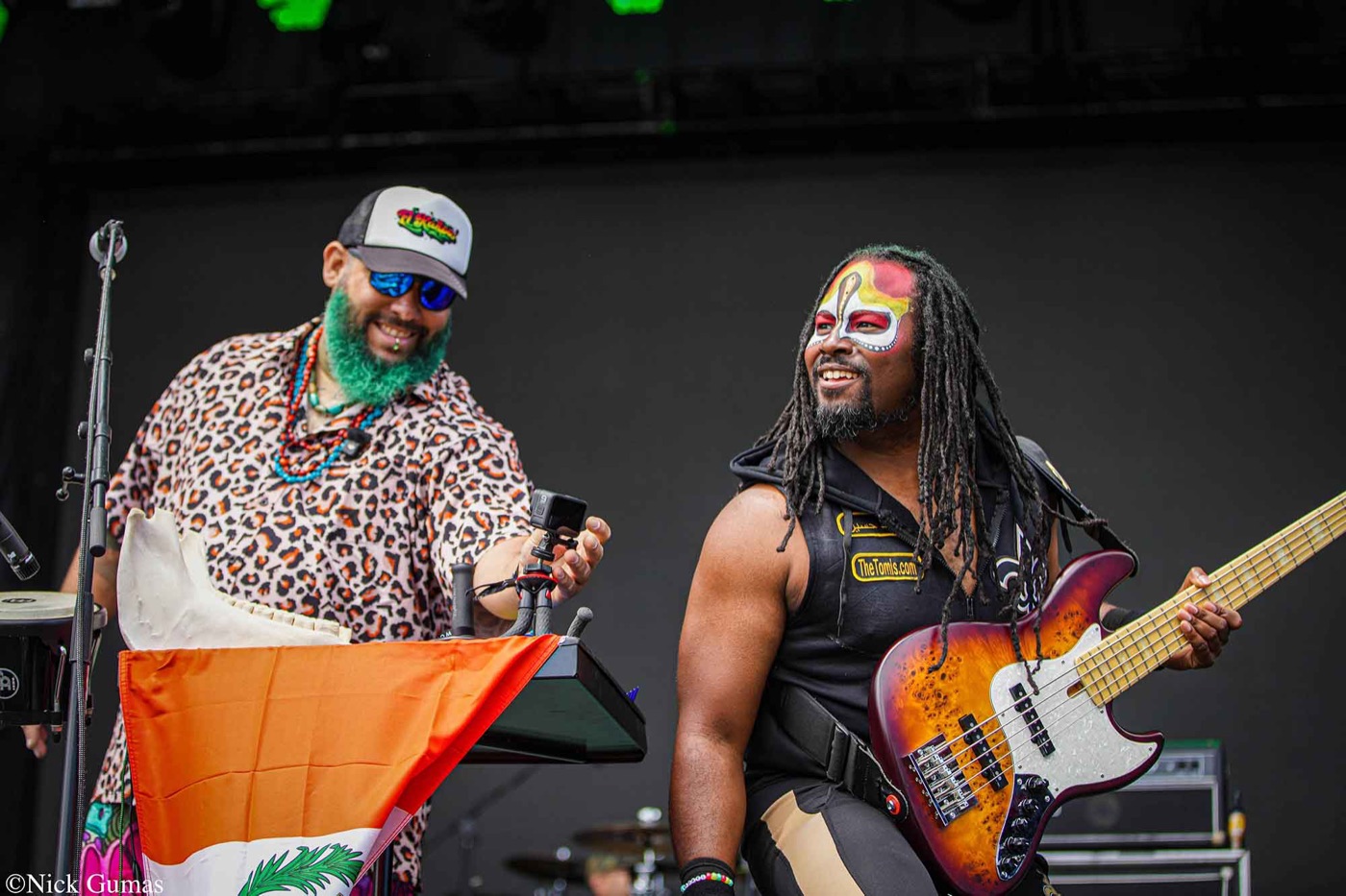 Sensory TRiBE musicians smiling together onstage; photo by Nick Gumas